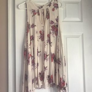 FREE PEOPLE floral sleeveless shirt.